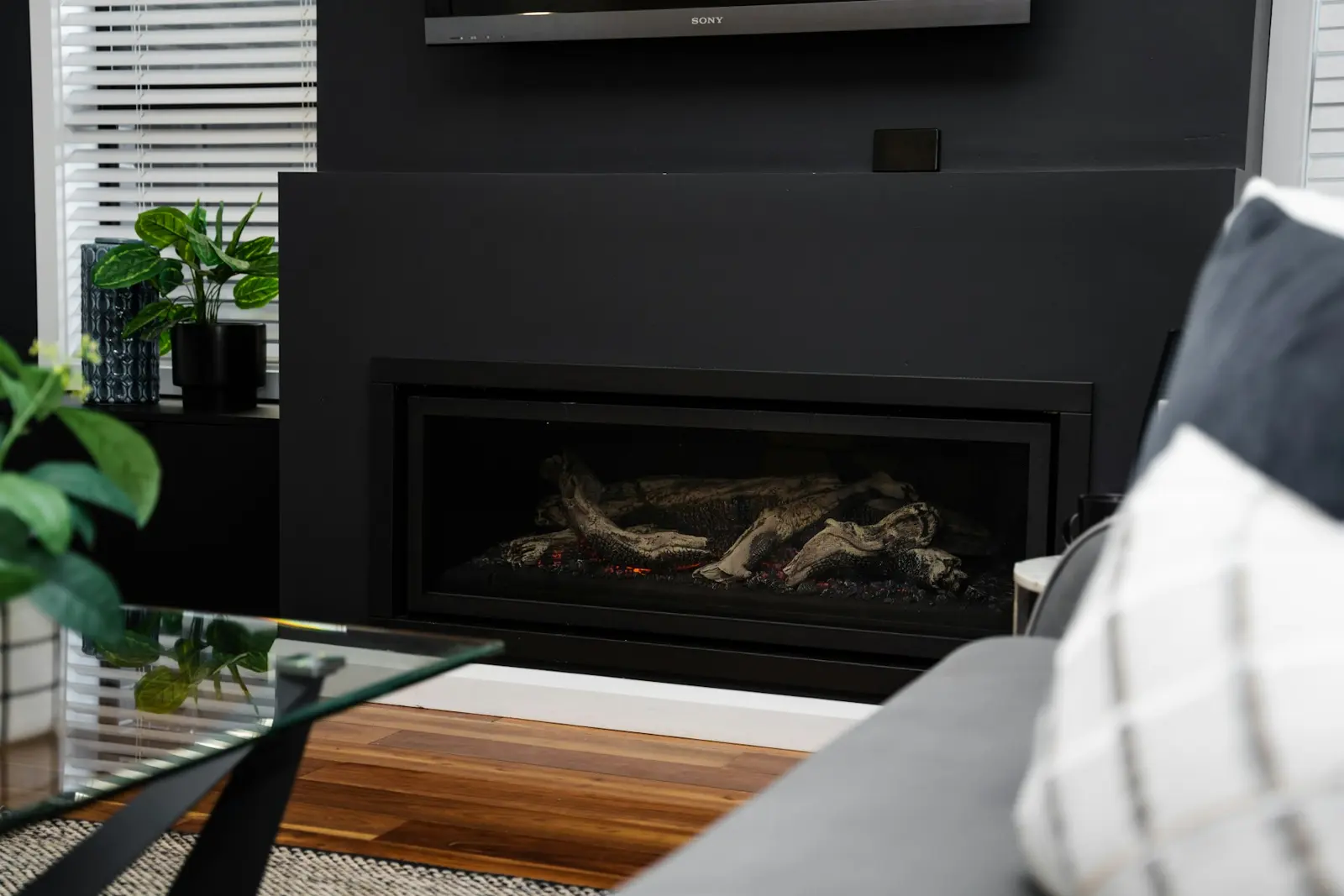 Gas log fireplace in a black surround