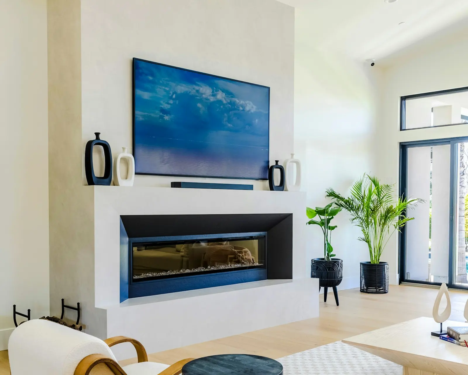 Linear gas fireplace in a white living room